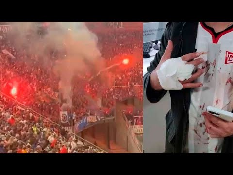 Nacional fans threw flares at Estudiantes fans during the Copa Libertadores.