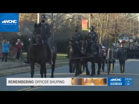 Horse drawn procession for fallen police officer
