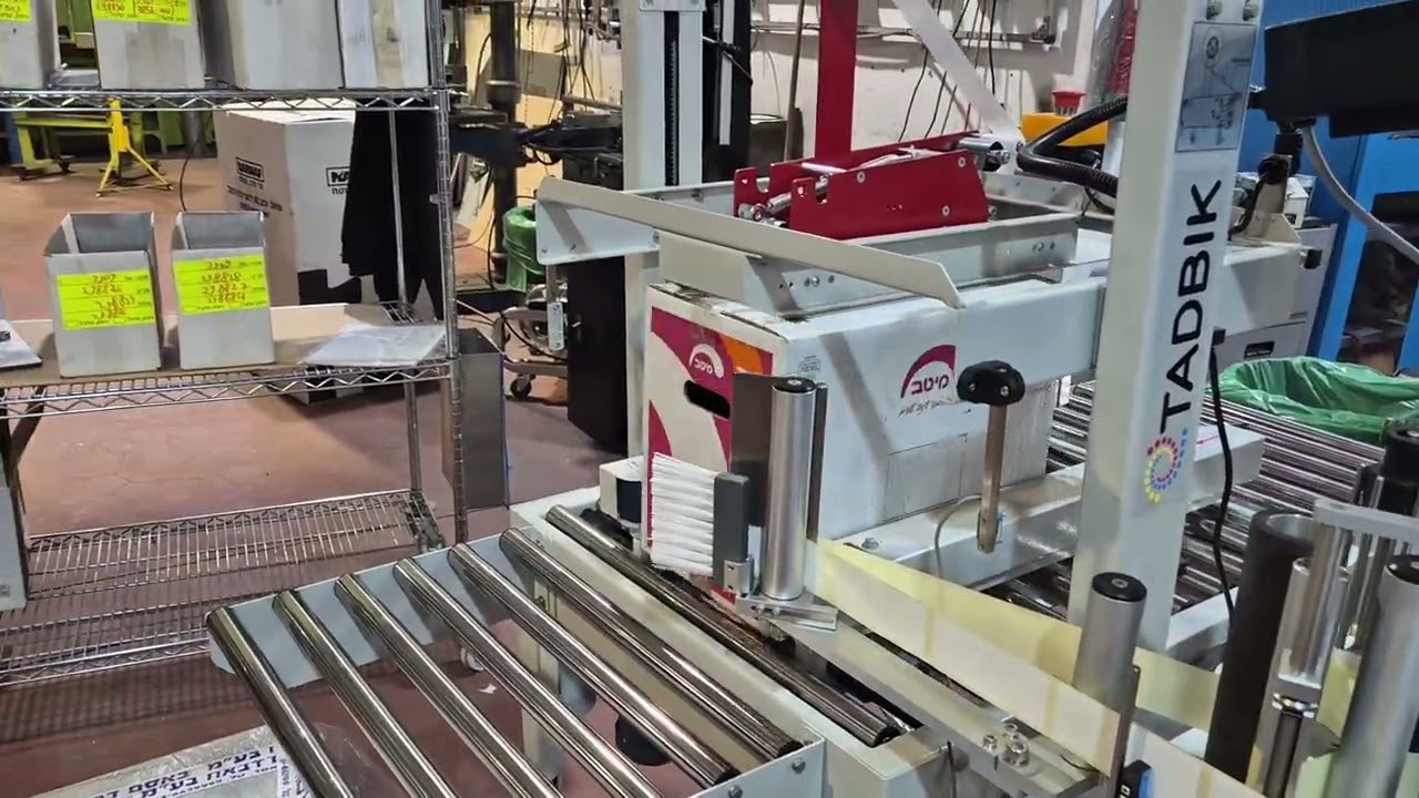Semi-Automatic Case-Carton Sealer with Integrated Label Applicator by TADBIK