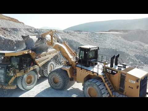 Caterpillar 992K Wheel Loader Loading Caterpillar 777F Dumpers - Interkat SA - Drone View