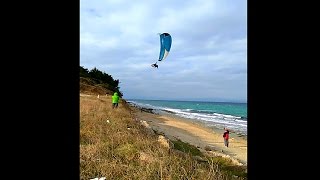 Paragliding take off from the beach in strong wind