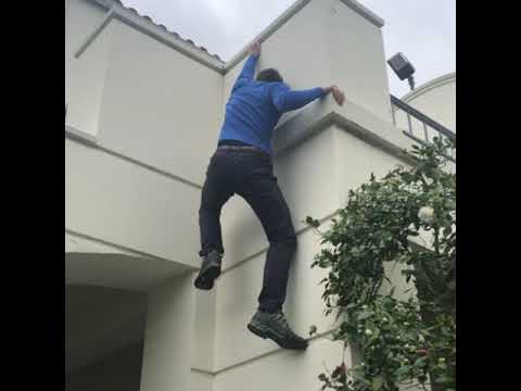 Alex Honnold climbs a building on the AFI campus