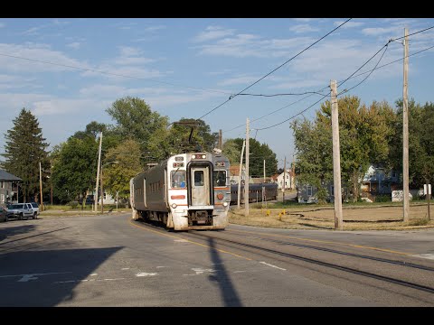 Interurban Street Running On The South Shore Line Plus Amtrak In Michigan City Indiana