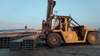 Hard Work......Old Caterpillar Loading Steel Channel Bar.......