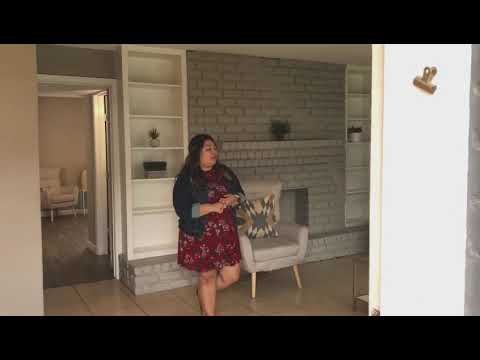 Hearthstone: 1 bedroom, 1 bathroom, 736 sq ft | faux fireplace, built-in bookshelves, his and hers walk-in closets, living area, kitchen