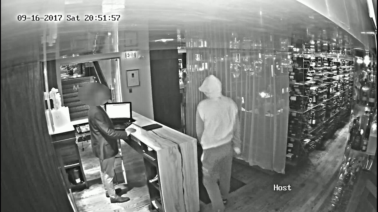 Video of a suspect in the murder of Simon Giannini entering and exiting Michael's On Simcoe restaurant. The hooded sweatshirt is darker than it appears on video