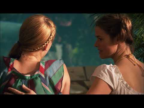 Trailer still: Carmen in the DJ booth silhouette; foreground hands up on the WAX dancefloor