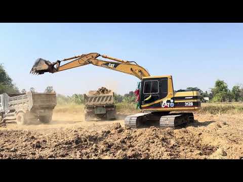 Caterpillar 395 Excavator Loading Trucks With Two Passes  - 4k