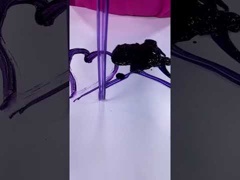 Mixing an entire bottle of purple food coloring into slime