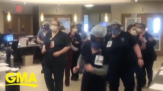Hospital staff dance together to de-stress during 