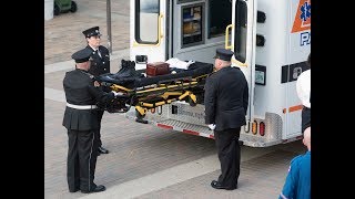 Emergency service procession for paramedic Robbie Curtis