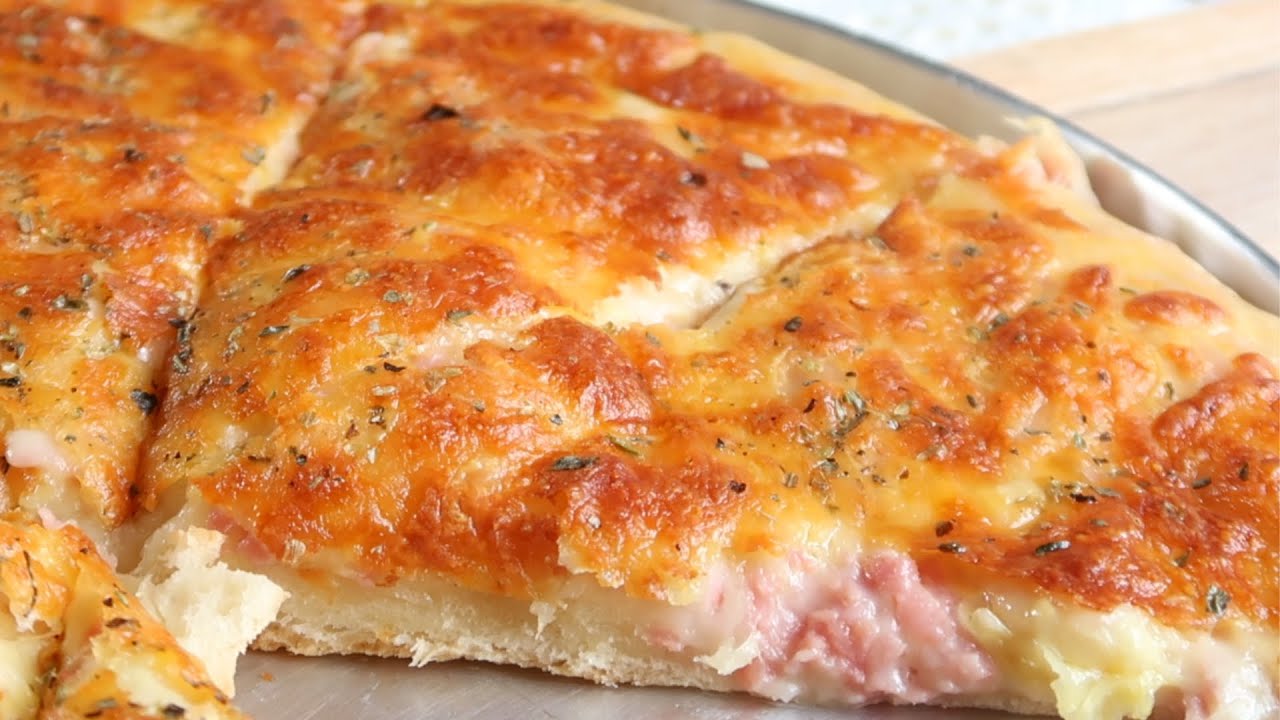 Se Você Ama Pizza, Não Pode Perder este Salgado Assado com Recheio Suculento e Muçarela Crocante!