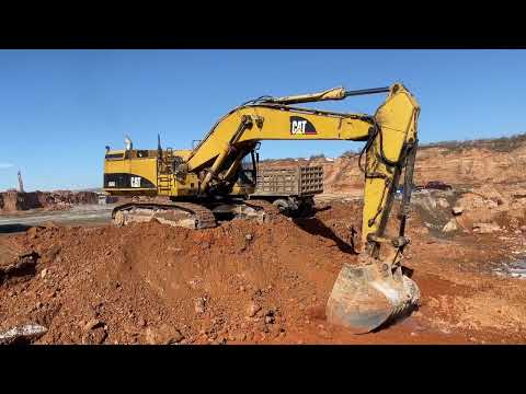 Caterpillar 365C Excavator Loading Mercedes & MAN Trucks
