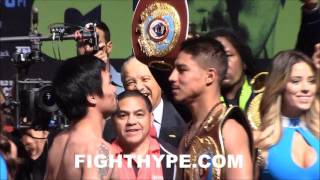MANNY PACQUIAO SMILES WHILE JESSIE VARGAS MEAN MUGS DURING STAREDOWN; FINAL FACE OFF