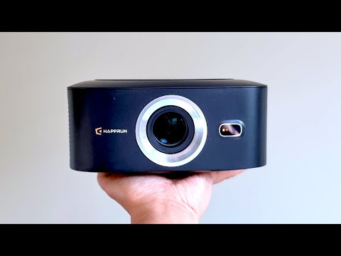1500 ANSI Official Licensed Google TV Smart Projector, HAPPRUN 4K Full HD Home Theater with Auto Focus, Dolby Sound, Wi-Fi Bluetooth, Built-in Apps, Compatible with Phone & PC, Indoor & Outdoor Use video review thumbnail