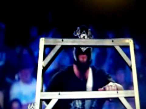 Big Show takes off CM Punk's mask to reveal Punk's bald head.