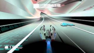 Playing Wipeout HD Fury and listening to Escape 700 by The Chemical Brothers.