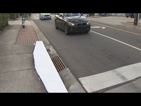 With crosswalks painted, Florida crews now removing storm drain murals