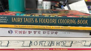 A mini coloring book haul and month of June completed pages.