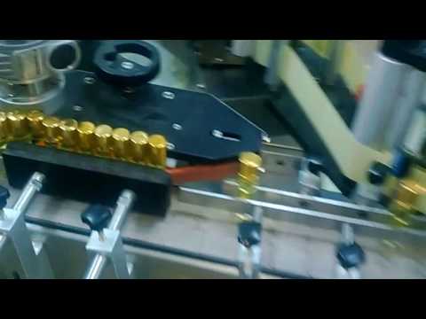 AUTOMATIC ROLL-ON BOTTLE LABELING MACHINE