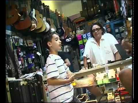 Little Boy Singing in Record Store 