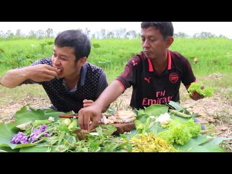 Two Man Eating Delisious Grill Pork With Mixing Source and Vegetables