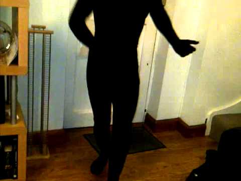 simon dancing in the gimp suit to dire straits