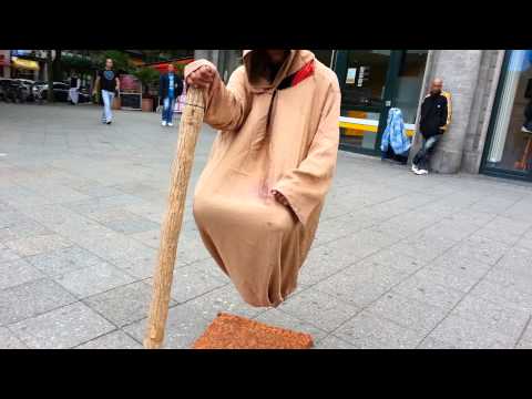 Floating man - at a sidewalk in Berlin, Germ