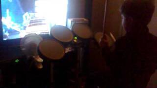 5 yr old playing drums on Rock Band 2