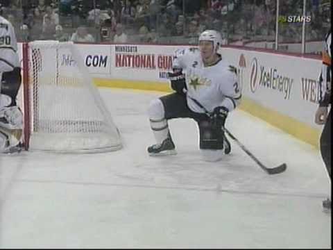 Eric Nystrom drills Niklas Grossman