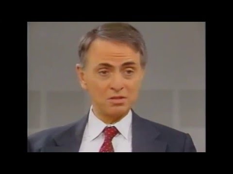 Ted Turner asks Carl Sagan if he is a socialist.