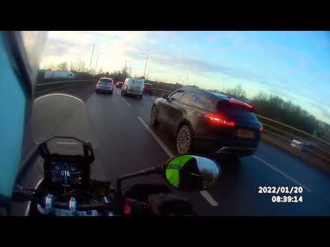 Range Rover driver too busy to look