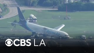 5 dead after Amazon cargo jet rolls off Miami International Airport runway