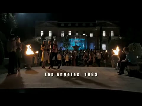 Trailer close-up: a balcony stare-down as the music drops out, score pulses in