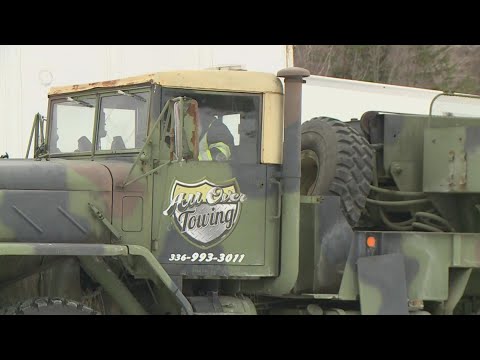 Tow truck drivers help people get unstuck from the snow and ice