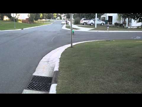 Derrick getting pushed on a skateboard