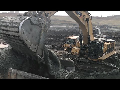 Two Liebherr 964-Caterpillar 390D And Caterpillar 385C Excavator Loading Caterpillar Dumpers & Truck