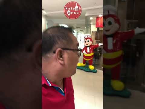 Quiosque de auto-encomenda Jollibee e correia transportadora para viagem no Jollibee Ayala Center Cebu