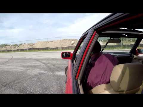 BMW E30 325i Doing Burnout and doughnuts in empty lot