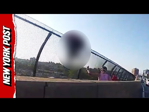Shocking moment NYPD rushes to save woman from jumping to her death