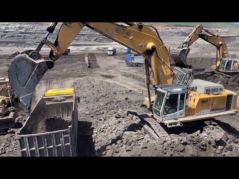 Liebherr 974 Excavator Loading Mercedes And MAN Trucks