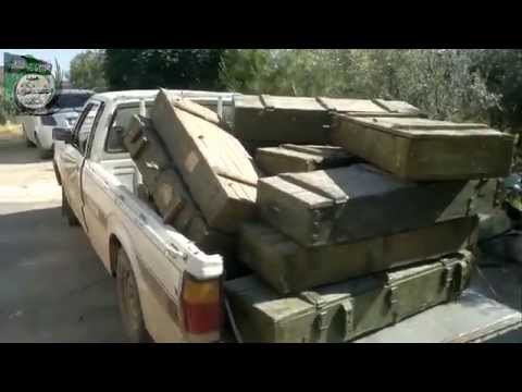 نقل الأسلحة والذخائر التي تم اغتنامها بعد السيطرة مستودعات خطاب في ريف حماة