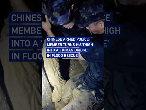 Chinese Armed Police member turns his thigh into a 'human bridge' in flood rescue