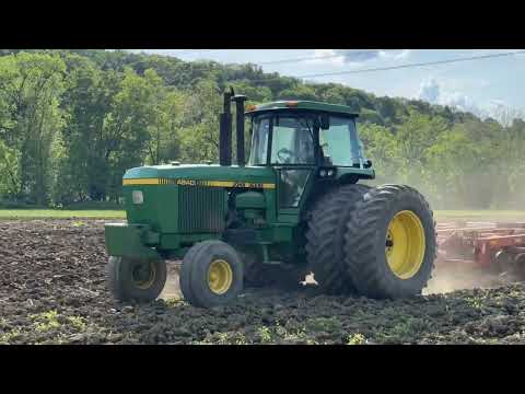 John Deere 4840 discing a corn field