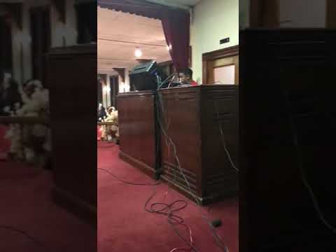 Gavin Rushing backing up Bishop Bruce Parham on organ