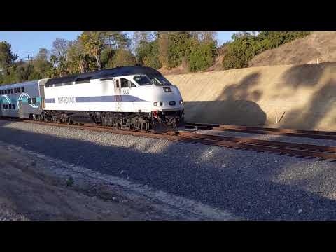 Metrolink MP36PH-3C #902 pulls a train with 6 cars, Rotem cab car #682 trailing.