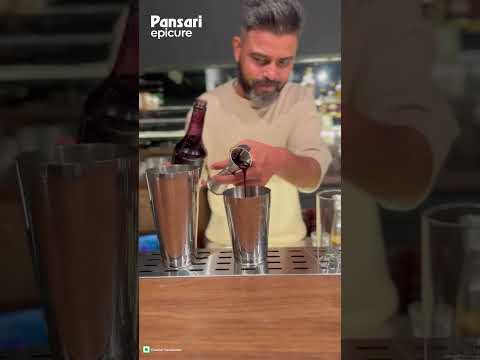 Elevate your cocktail game with Mojee's 100% fruit-based Kala Khatta syrup.