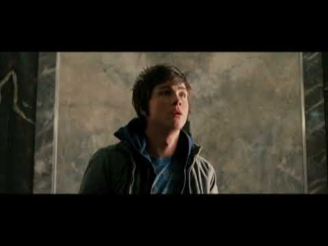 Official trailer still of Percy facing the Minotaur on a rain-soaked highway