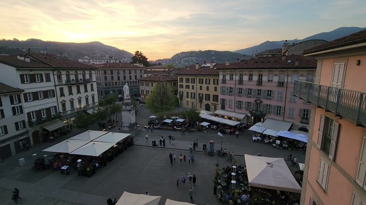 Discover the timpelapse at Piazza Alessandro Volta during sunset.