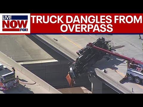 Video | Breaking: Truck dangles from overpass in TX